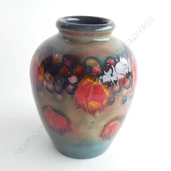 A Moorcroft flambé vase, Leaf and Berry pattern.